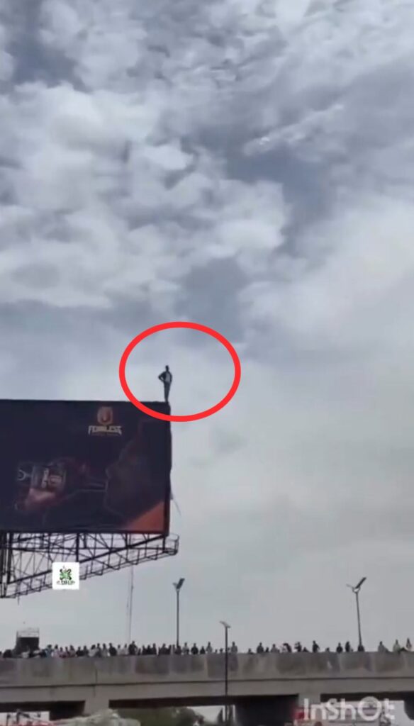 Man Threatens To Jump Off Giant Billboard In Kano State Over Hash Economy